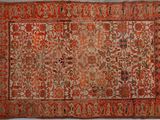 tapis persan ancien à motif floral sur fond rouge