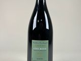 a bottle of wine that is sitting on a table