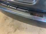 a close up of a car ' s bumper with a sticker on it