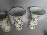 three vases sitting next to each other on a table