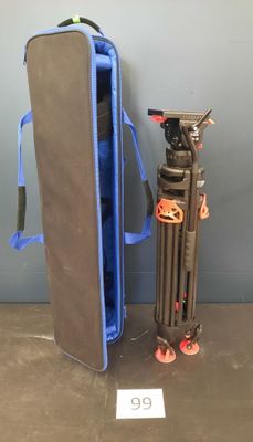 a bag and a tripod sitting next to each other on the floor