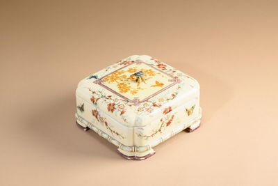 a small white box with a floral design on it
