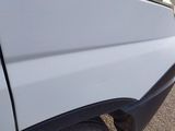 a close up of a car door handle with a rope on the side of it