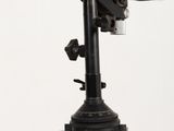 a close up of a camera on a tripod with a white background