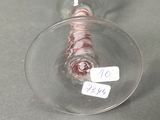 a wine glass sitting on a table with a label on it