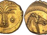 a gold coin with an image of a woman ' s face on it
