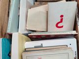 a box full of books that are sitting on the floor