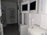 a bathroom with two sinks and a shower in it
