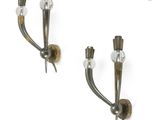 pair of wall sconces in the shape of a pair of candles