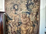a tapestry hanging on a wall in a room