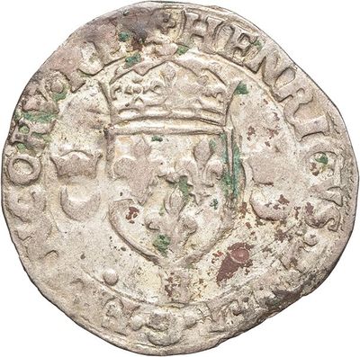 a close up of a coin with a crown on it