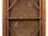 an old wooden window with a wooden frame on the outside of it