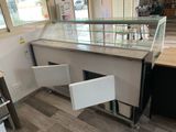 a counter with a glass case on it in a store