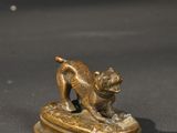 bronze figurine of a cat and a dog on a pedestal
