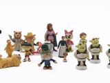 many figurines of different characters on a white surface