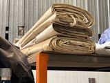 a pile of cloth sitting on top of a metal shelf