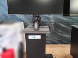 two monitors and a keyboard on a table