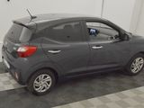 a picture of a gray car parked in a garage
