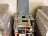 a stack of boxes and a box with a remote in it