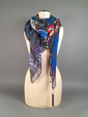 a close up of a mannequin torso with a scarf on it