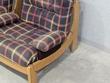 two chairs that are sitting next to each other in a room