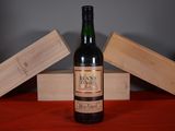 a bottle of wine that is sitting on a table