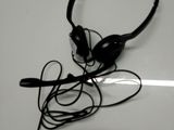 a pair of black headphones on a white surface