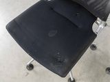 a black chair with a black seat and a black seat cushion