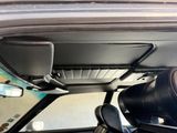 a view of the inside of a car from the driver ' s seat