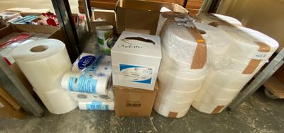 many rolls of toilet paper and rolls of toilet paper on the floor