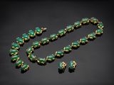 a green jade and gold necklace and earring set