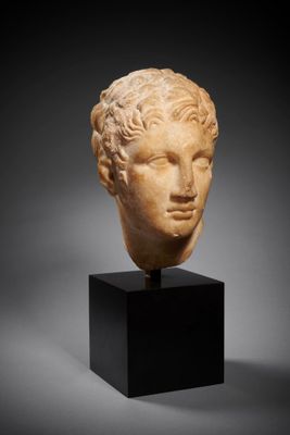 a roman marble head of a youth