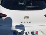 someone is taking a picture of the rear of a car with their cell phone