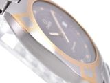 a close up of a watch on a white surface