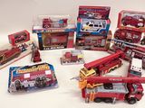 a lot of toy fire trucks that are on the table
