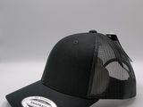a black trucker hat with a white logo on the front