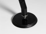a black pen sitting on top of a white table