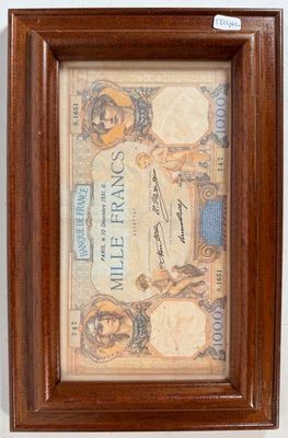 an old framed picture of a couple of people on a bank note