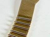 a close up of a belt on a white surface