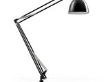 une lampe de bureau noire posée sur une surface blanche, avec un fond blanc