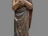 an image of a statue of a woman holding a cross