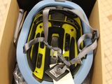 a box with a helmet inside of it on the floor