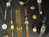 a lot of watches that are sitting on a table