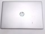 a laptop that is sitting on a white table
