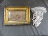 un tableau accroché au mur à côté d'un autre tableau accroché au mur
