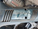 a close up of a car ' s engine with a wrench