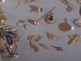 many different types of jewelry displayed on a table