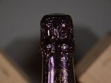 a close up of a bottle of wine on a table
