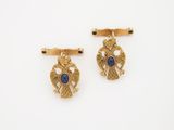 deux paires de boutons de manchette en or sertis de pierres bleues