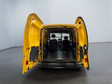 the back of a yellow van with its doors open in a room